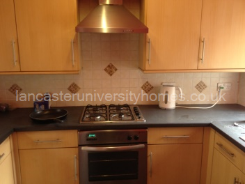 Kitchen with loads of cupboards & dishwasher. 