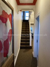 Downstairs hallway, just inside the front door.