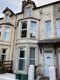 Front of house. I also own next door and both would suit a group of 12. 