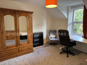 Top floor, front bedroom. Very large room with massive wardrobe, new desk and very comfy armchair in the corner