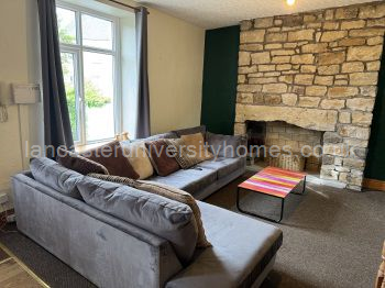 Middle-floor open-plan lounge & kitchen. L-shaped sofa and kitchen table & chairs bought in 2025. 52-inch smart tv. 